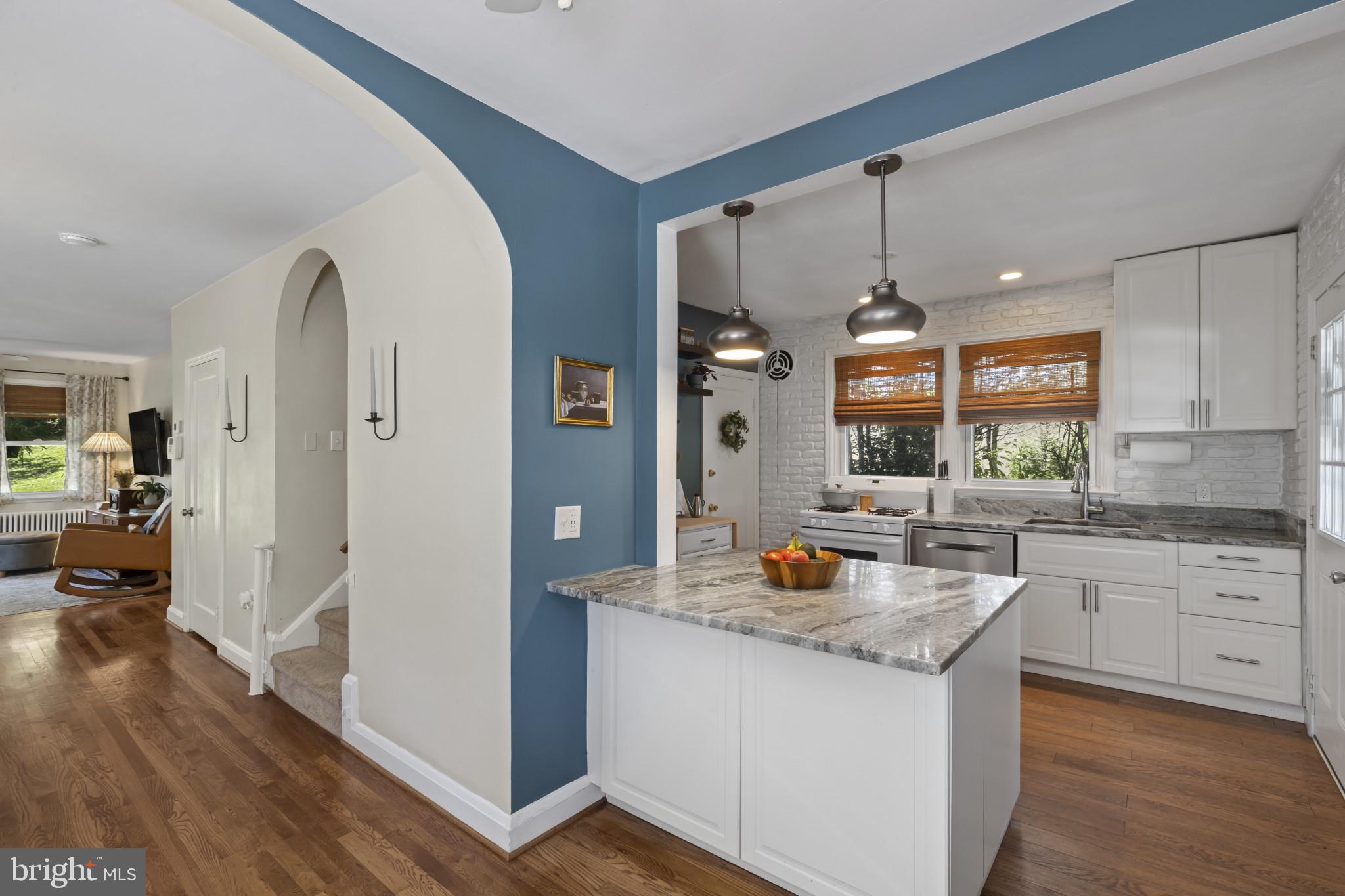 6500 Sharon Road Baltimore, MD 21239 - Photo 12 of 33 a kitchen with granite countertop white cabinets and refrigerator