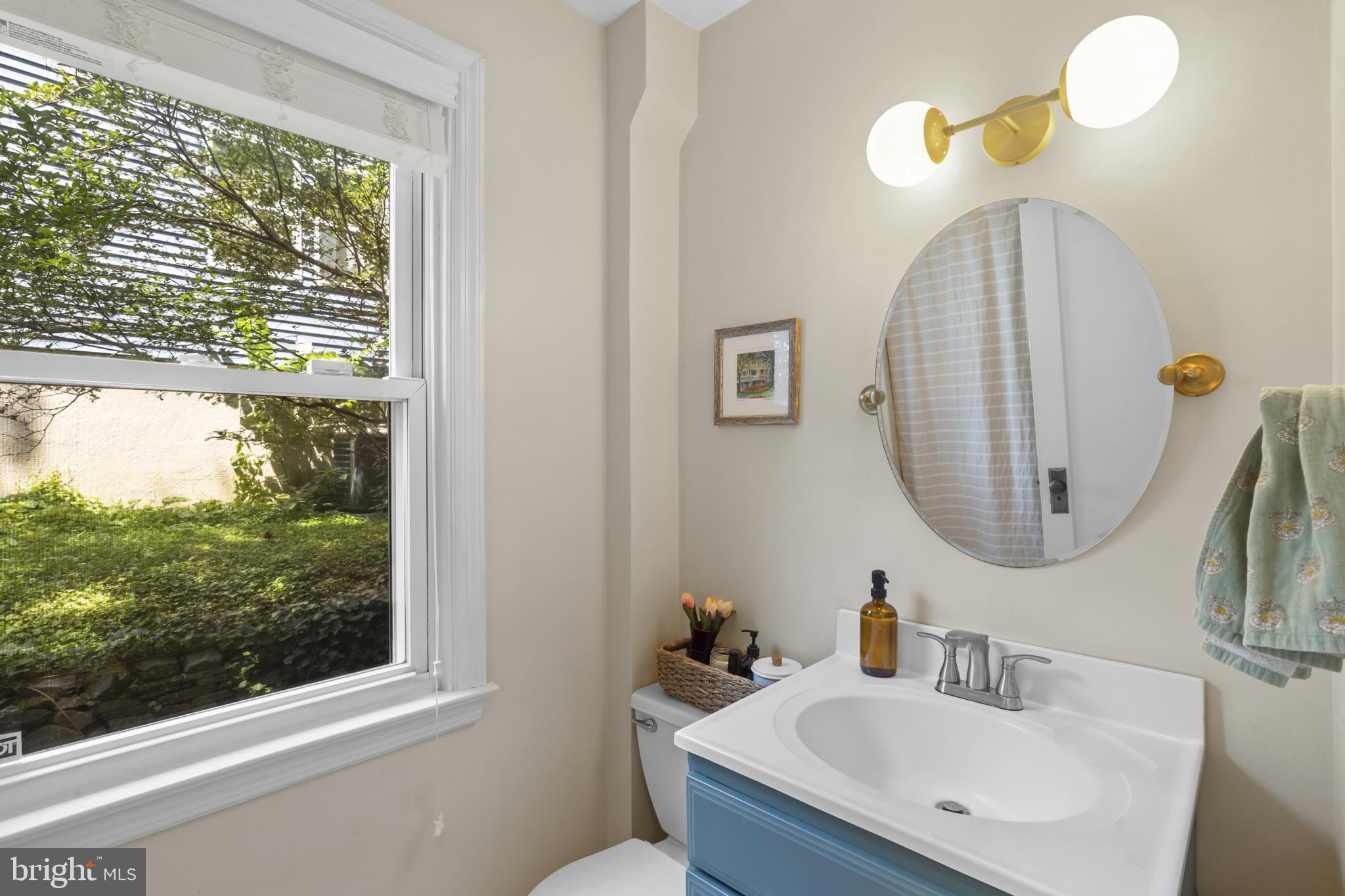 6500 Sharon Road Baltimore, MD 21239 - Photo 17 of 33 a bathroom with a sink and a mirror