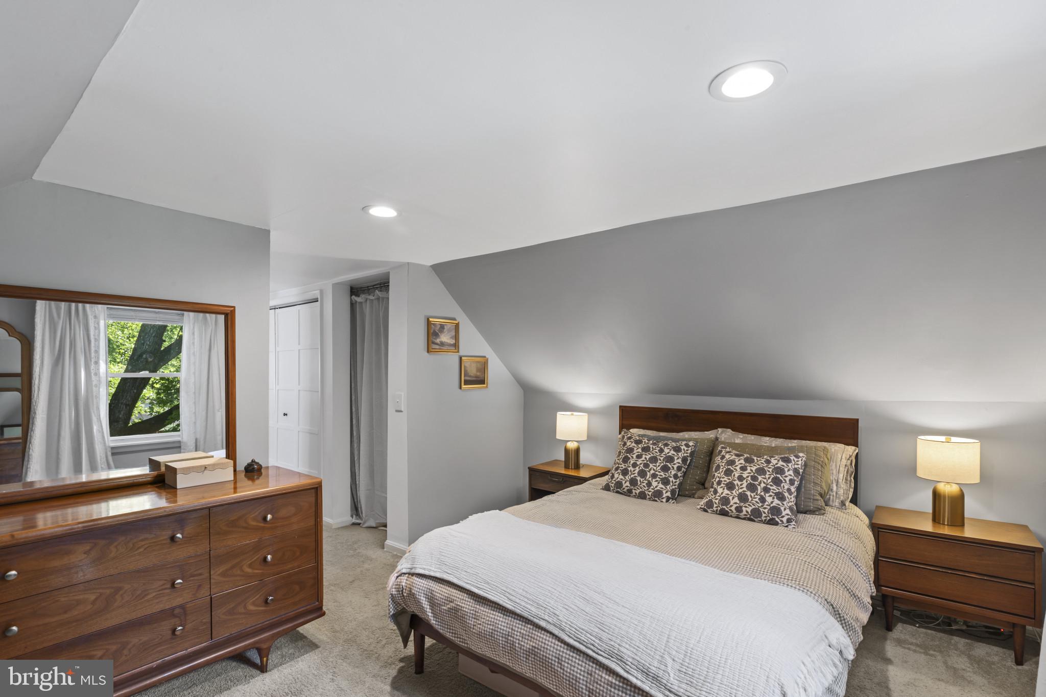 6500 Sharon Road Baltimore, MD 21239 - Photo 20 of 33 a bedroom with a bed and windows