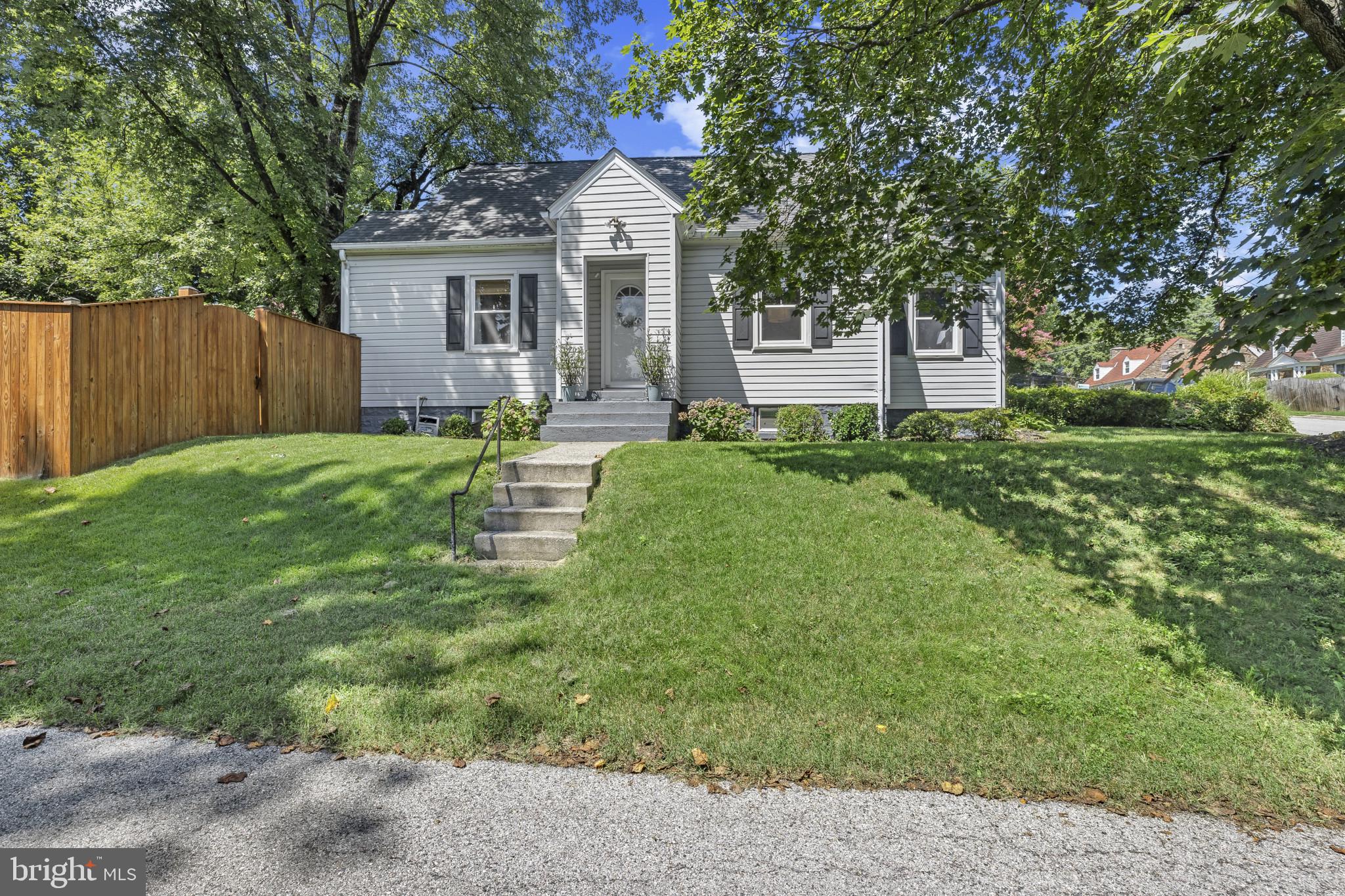 6500 Sharon Road Baltimore, MD 21239 - Photo 2 of 33 a view of a house with backyard and a tree