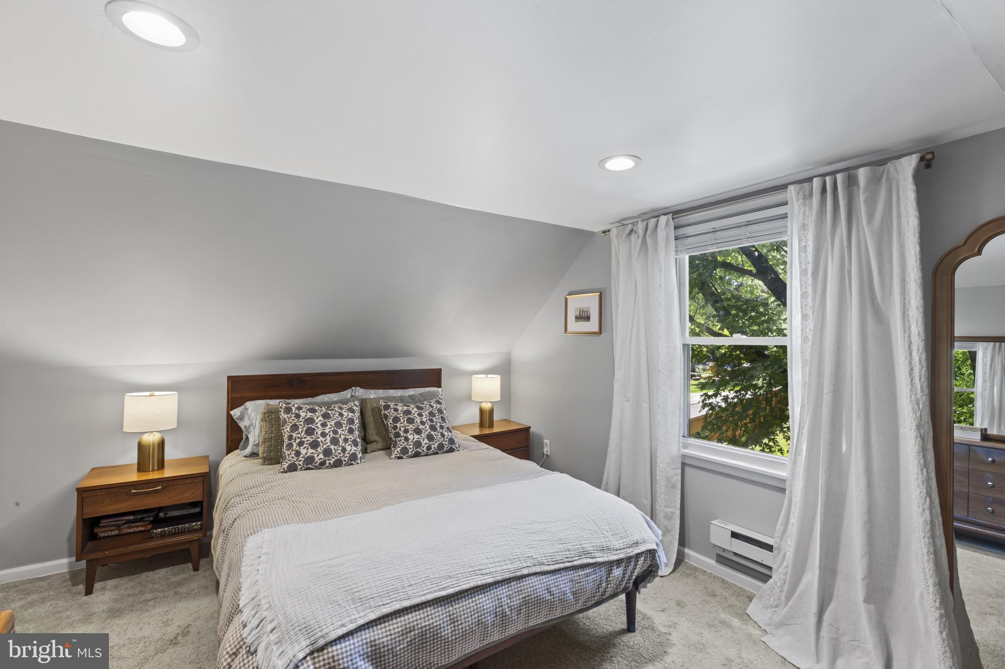 6500 Sharon Road Baltimore, MD 21239 - Photo 21 of 33 a bedroom with a large bed and a window