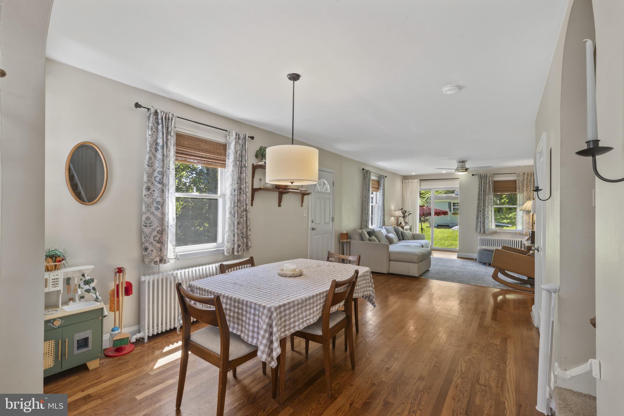 6500 Sharon Road Baltimore, MD 21239 - Photo 5 of 33 a view of a dining room with furniture window and wooden floor