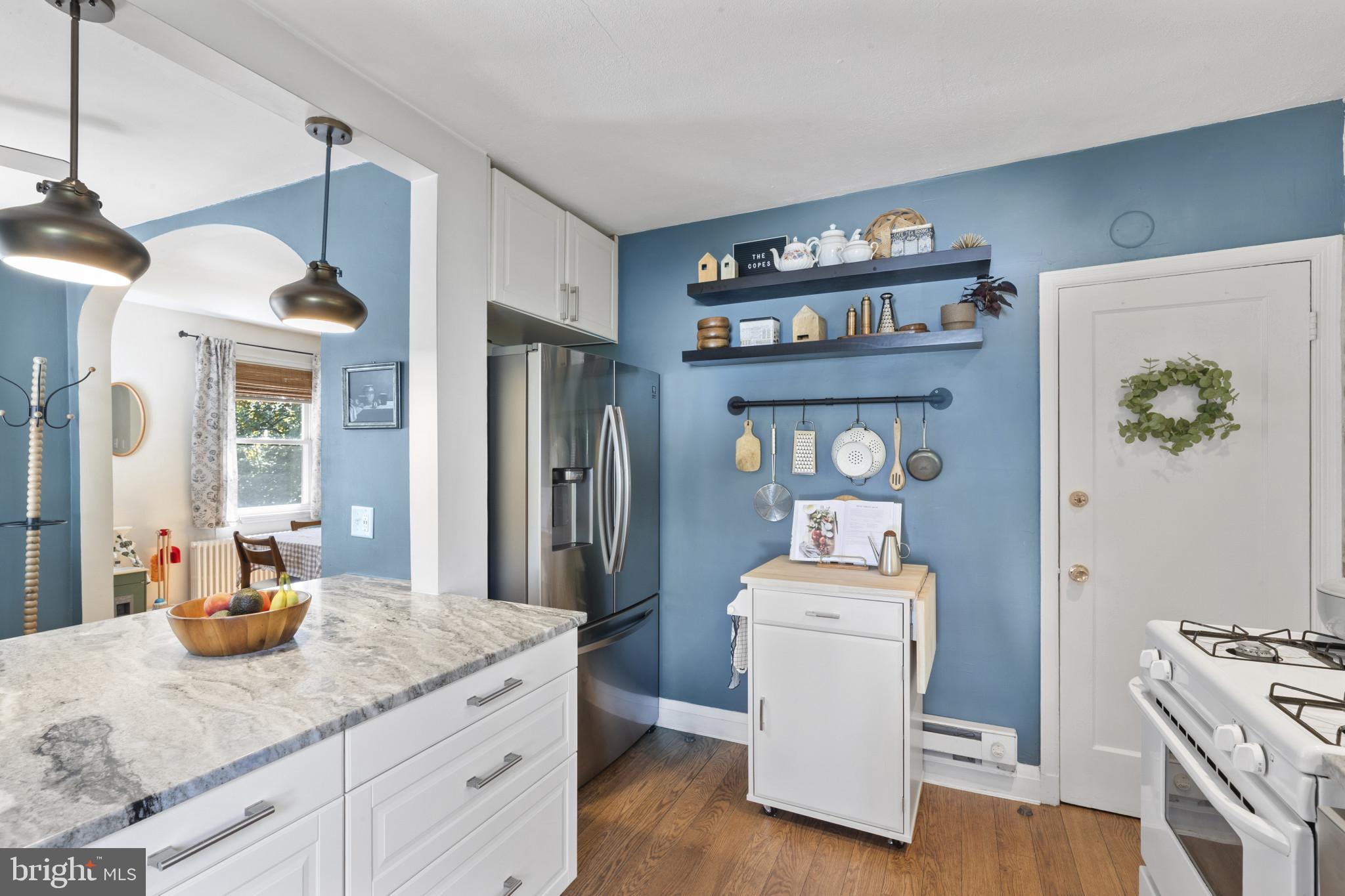 6500 Sharon Road Baltimore, MD 21239 - Photo 7 of 33 a kitchen with a sink appliances and cabinets