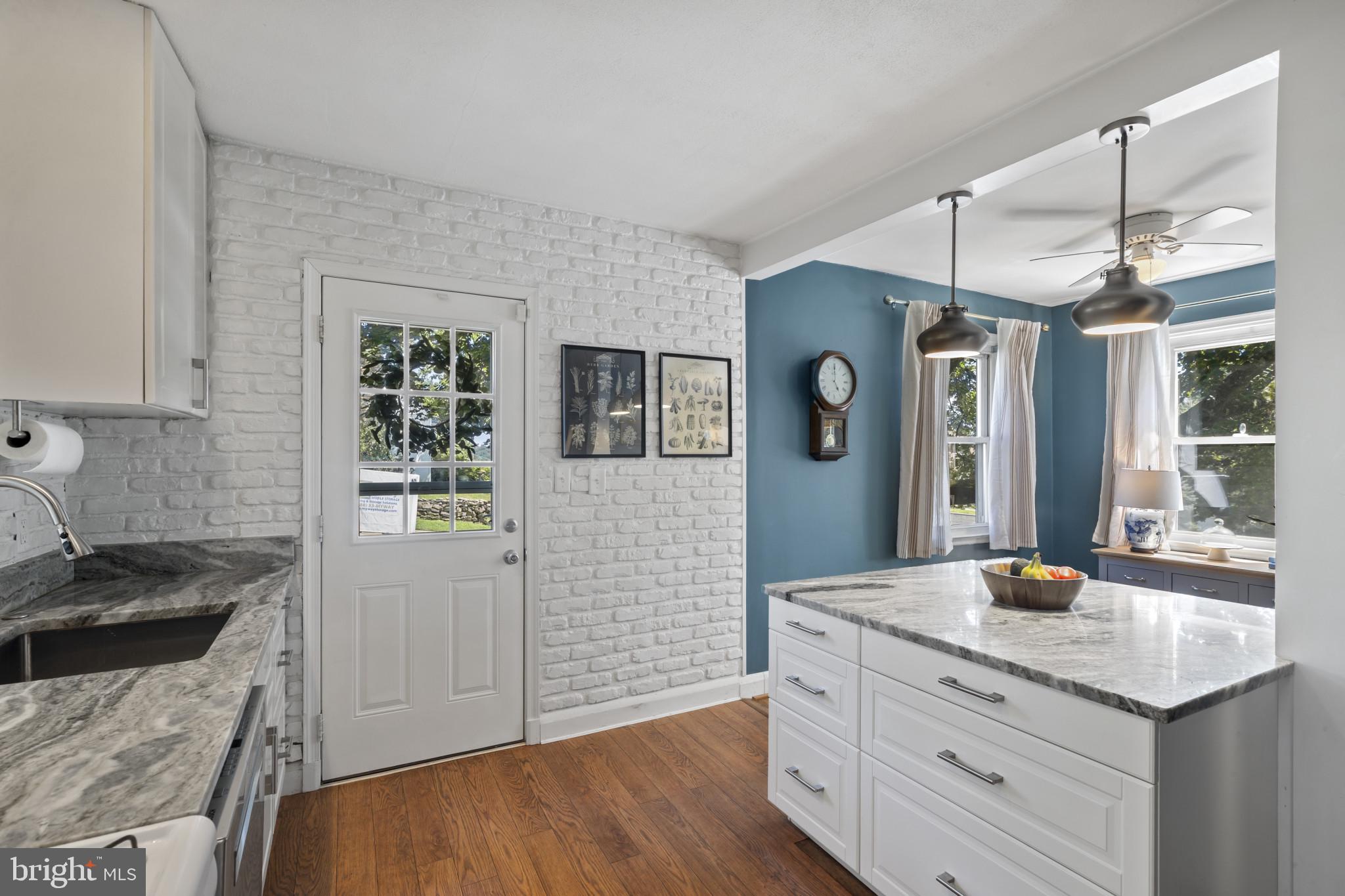 6500 Sharon Road Baltimore, MD 21239 - Photo 10 of 33 a kitchen with granite countertop a sink stainless steel appliances and cabinets