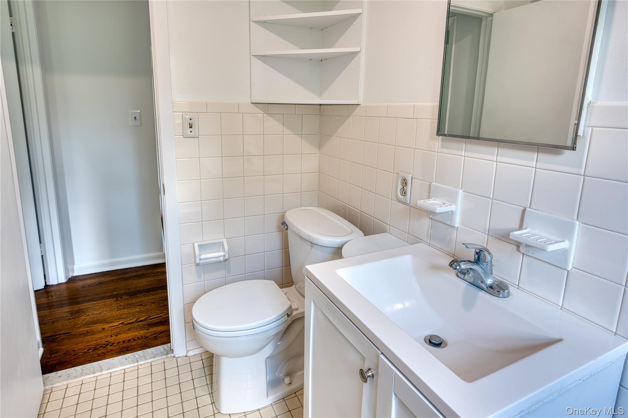 61 Indian Brook Road Garrison, NY 10524 - Photo 20 of 23 a bathroom with a sink toilet and mirror