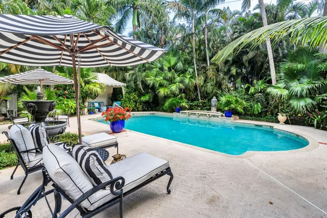 a view of a chairs and table in the patio