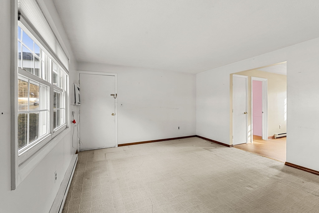 3 Wysocki Drive, Unit 6 Dudley, MA 01571 - Photo 15 of 24 a view of an empty room with a window