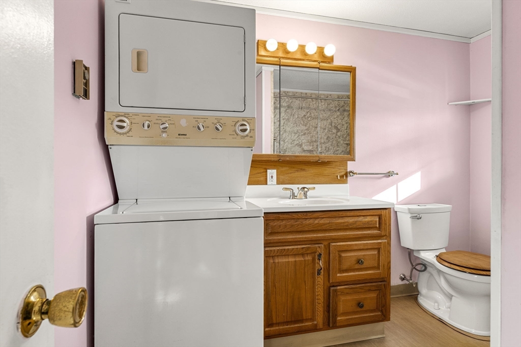 3 Wysocki Drive, Unit 6 Dudley, MA 01571 - Photo 18 of 24 a utility room with a sink dryer and washer