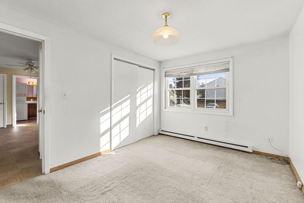 3 Wysocki Drive, Unit 6 Dudley, MA 01571 - Photo 8 of 24 an empty room with windows