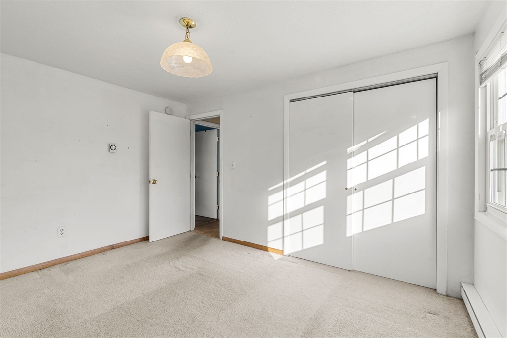 3 Wysocki Drive, Unit 6 Dudley, MA 01571 - Photo 9 of 24 a view of an empty room with a window