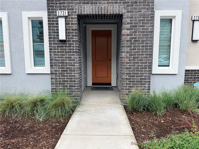 a view of a pathway besides a house
