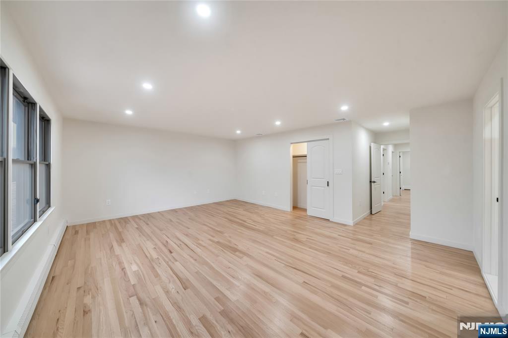 468 Morse Avenue Ridgefield, NJ 07657 - Photo 30 of 48 a view of an empty room with wooden floor and a window