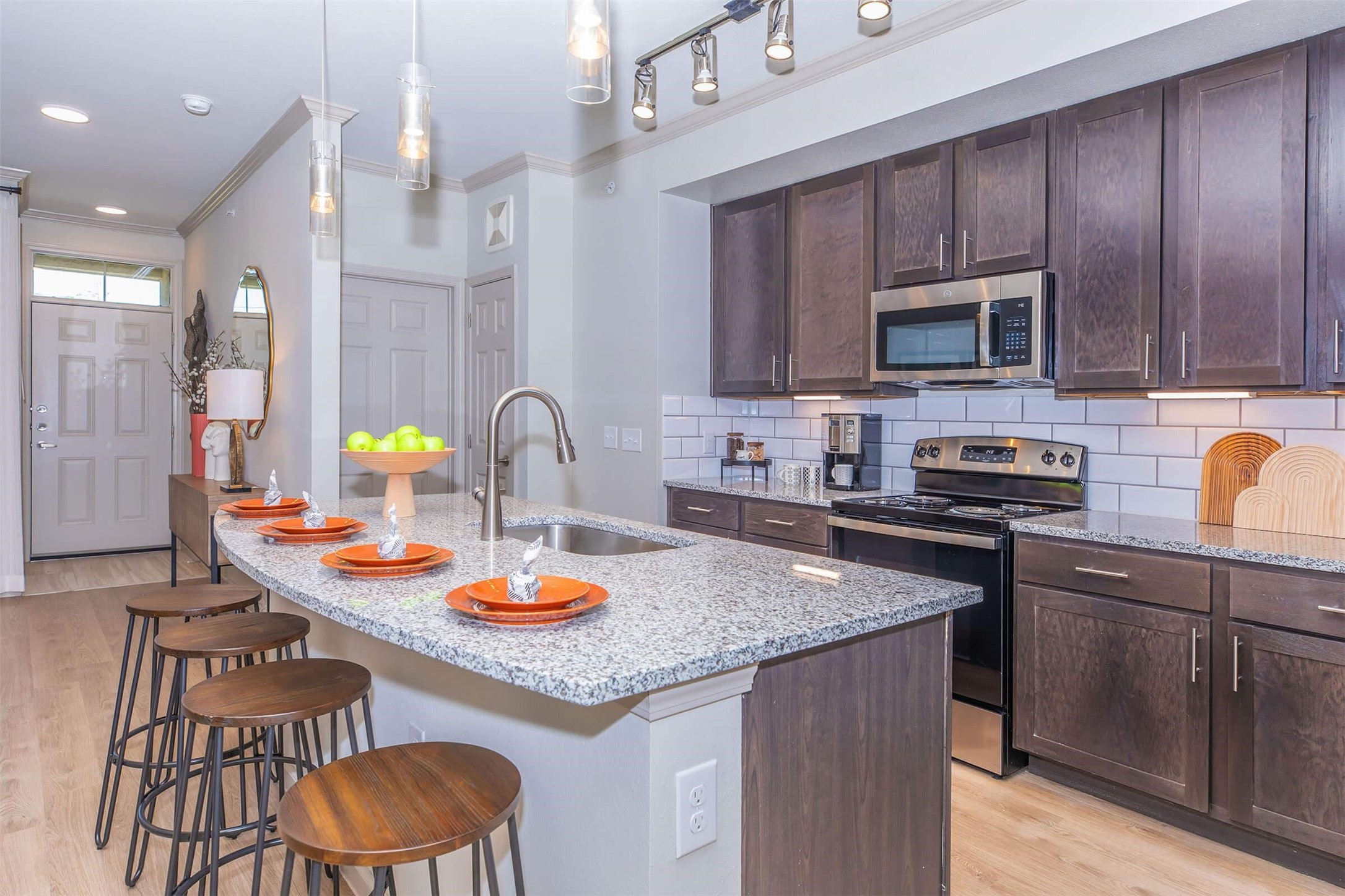 907 S Road, Unit 7202 Baytown, TX 77521 - Photo 1 of 12 a kitchen with a sink stove and cabinets