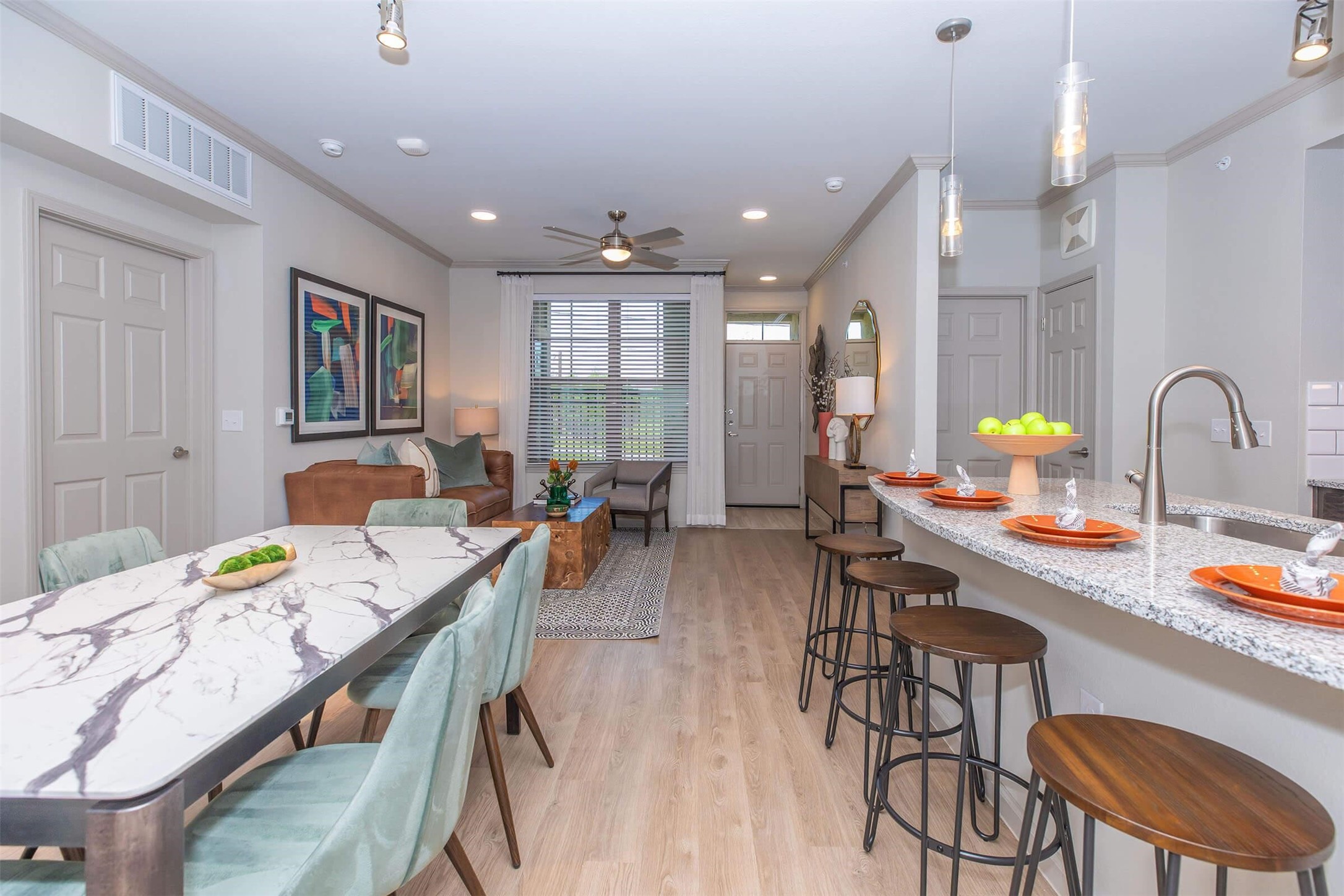 907 S Road, Unit 7202 Baytown, TX 77521 - Photo 6 of 12 a kitchen with stainless steel appliances granite countertop a table chairs and a stove