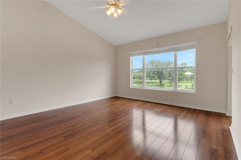 20141 Seagrove Street, Unit 308 Estero, FL 33928 - Photo 19 of 36 a view of an empty room with wooden floor and a window