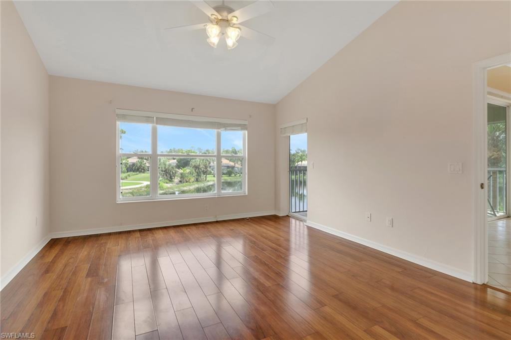 20141 Seagrove Street, Unit 308 Estero, FL 33928 - Photo 20 of 36 a view of an empty room with wooden floor and a window