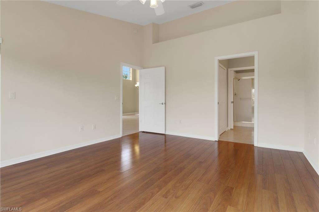 20141 Seagrove Street, Unit 308 Estero, FL 33928 - Photo 21 of 36 a view of an empty room and wooden floor