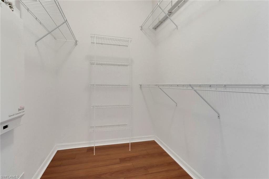 20141 Seagrove Street, Unit 308 Estero, FL 33928 - Photo 25 of 36 a view of a room with racks on the wall