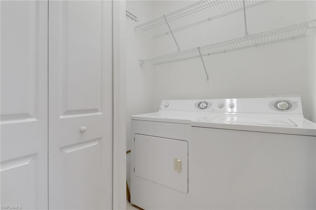 20141 Seagrove Street, Unit 308 Estero, FL 33928 - Photo 30 of 36 a utility room with dryer and washer