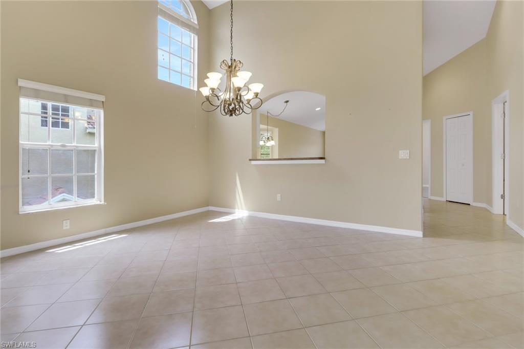 20141 Seagrove Street, Unit 308 Estero, FL 33928 - Photo 6 of 36 a view of livingroom with chandelier