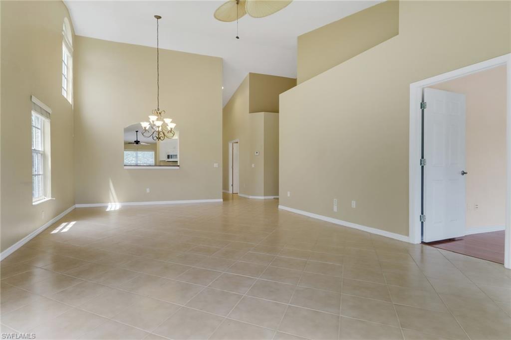 20141 Seagrove Street, Unit 308 Estero, FL 33928 - Photo 10 of 36 a view of a livingroom with a chandelier
