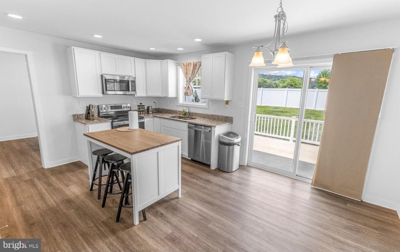 123 Hank Aaron Road Berkeley Springs, WV 25411 - Photo 14 of 32 Bright and airy modern kitchen space.