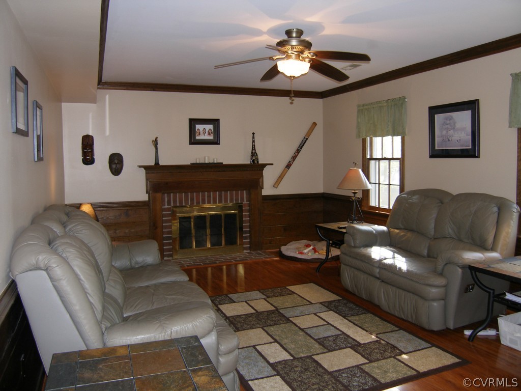 604 Fennimore Road Midlothian, VA 23114 - Photo 12 of 24 a living room with furniture flowerpot and a fireplace