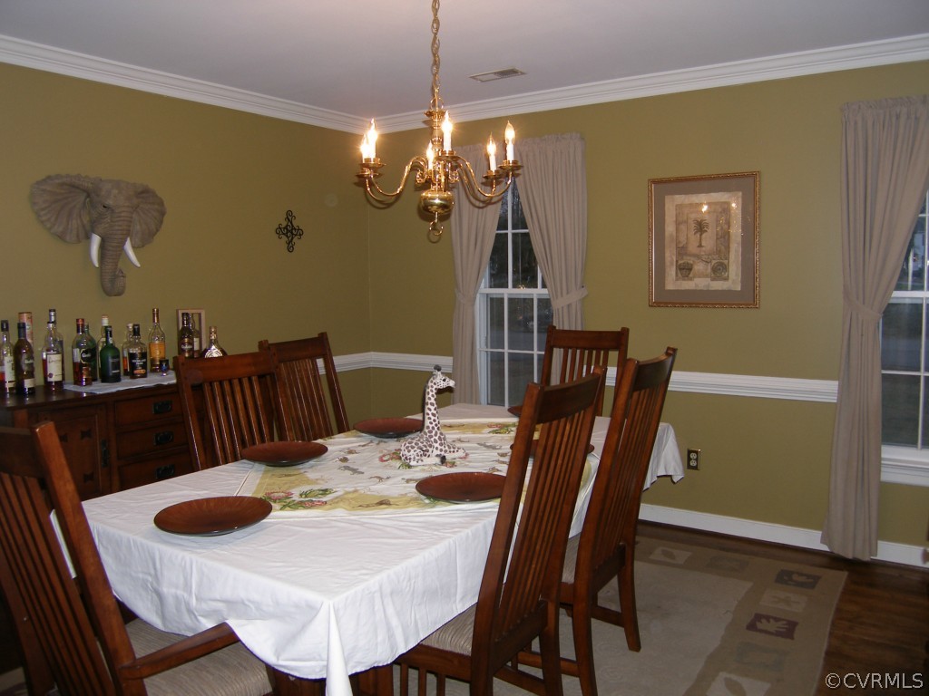 604 Fennimore Road Midlothian, VA 23114 - Photo 10 of 24 a view of a dining room with furniture and wooden floor