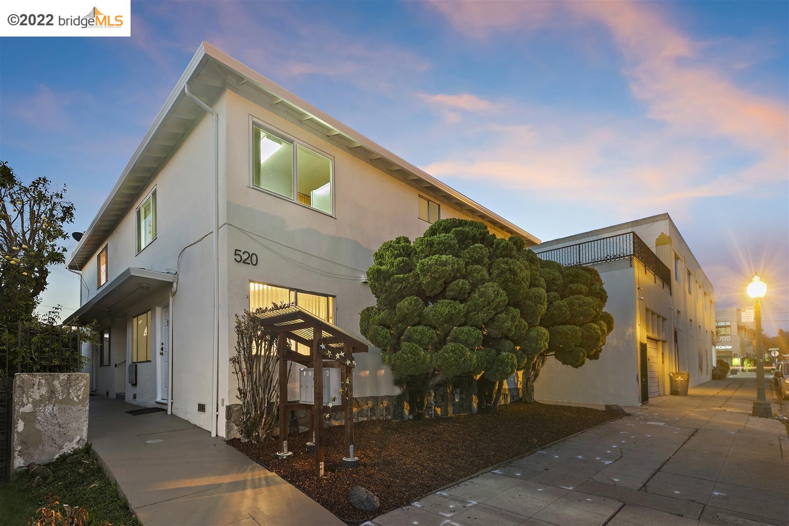 a view of a street with brick building in the background