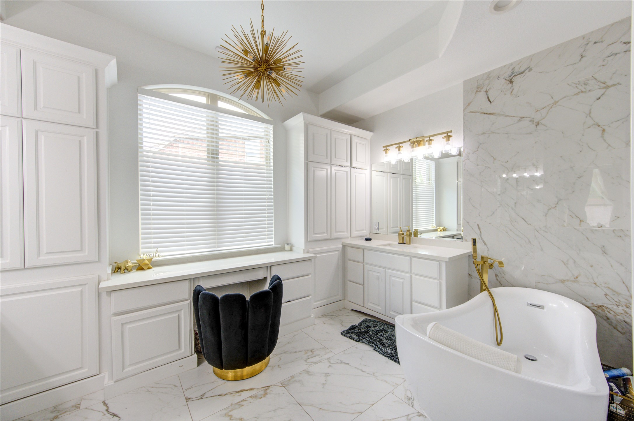 17539 Hankar Way Richmond, TX 77407 - Photo 17 of 34 a bathroom with a sink a bathtub and a window