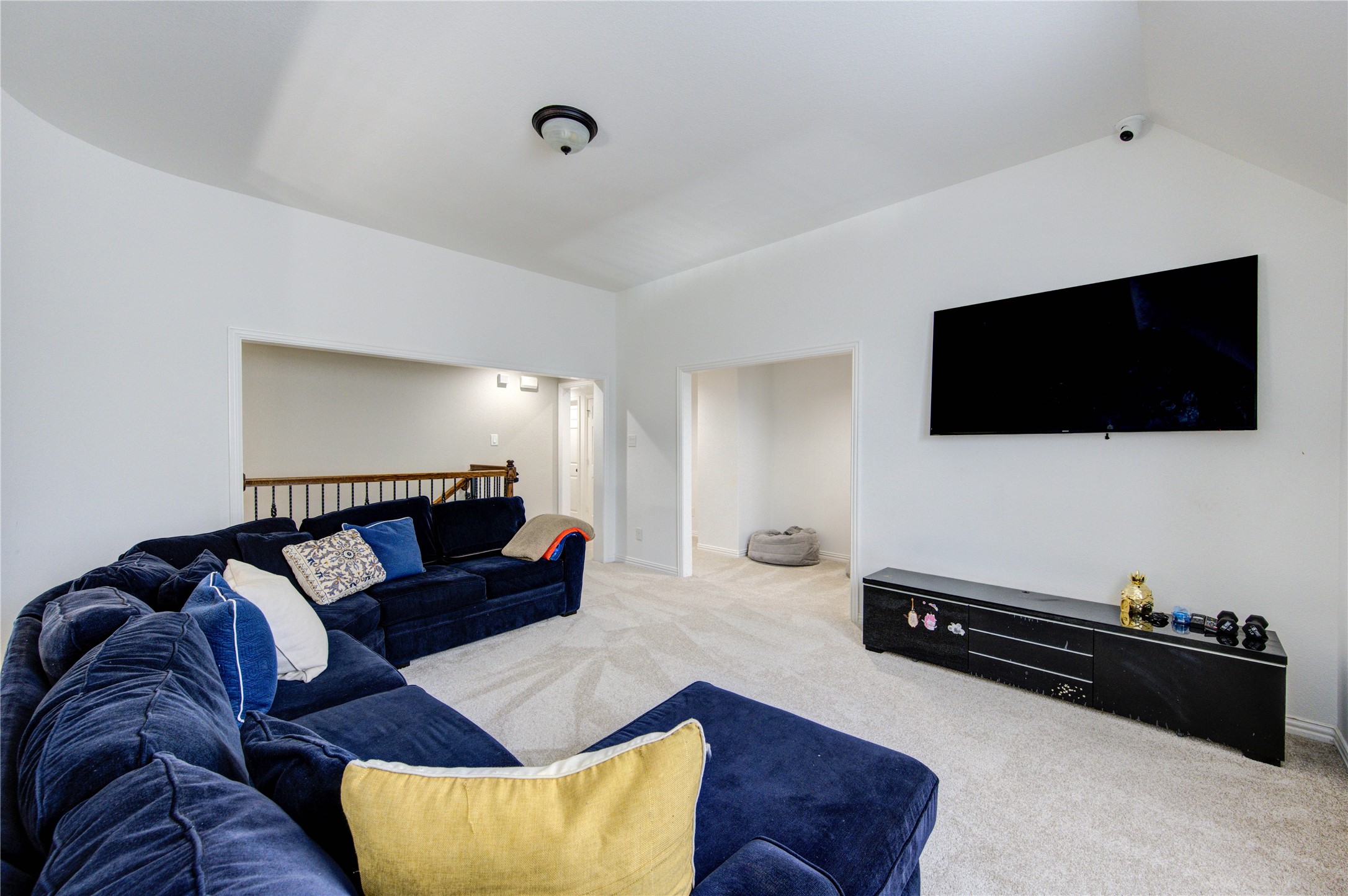 17539 Hankar Way Richmond, TX 77407 - Photo 24 of 34 a living room with furniture and a flat screen tv