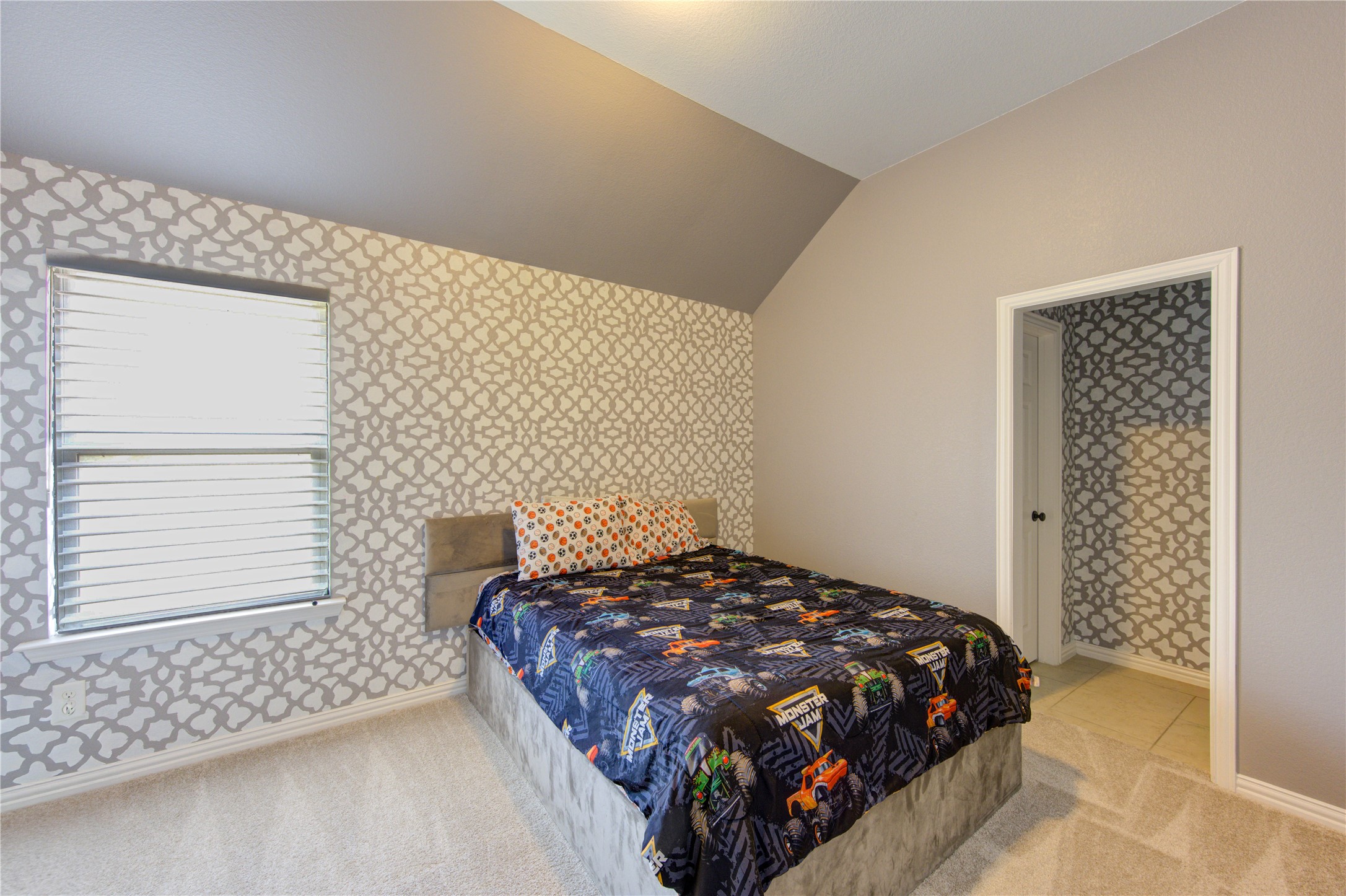 17539 Hankar Way Richmond, TX 77407 - Photo 27 of 34 a bed sitting in a bedroom next to a window