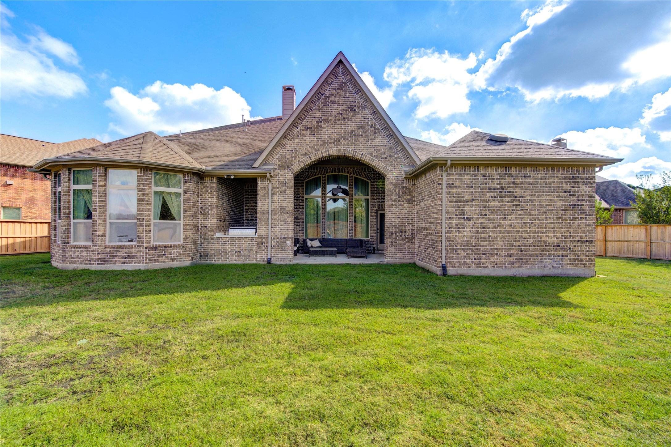 17539 Hankar Way Richmond, TX 77407 - Photo 32 of 34 a front view of a house with garden