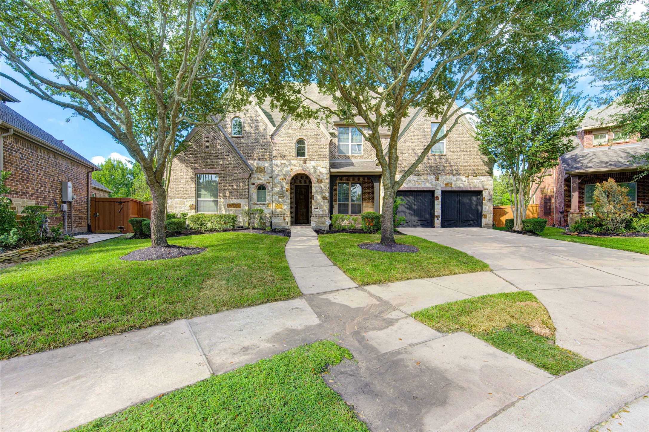 17539 Hankar Way Richmond, TX 77407 - Photo 34 of 34 front view of house with a yard