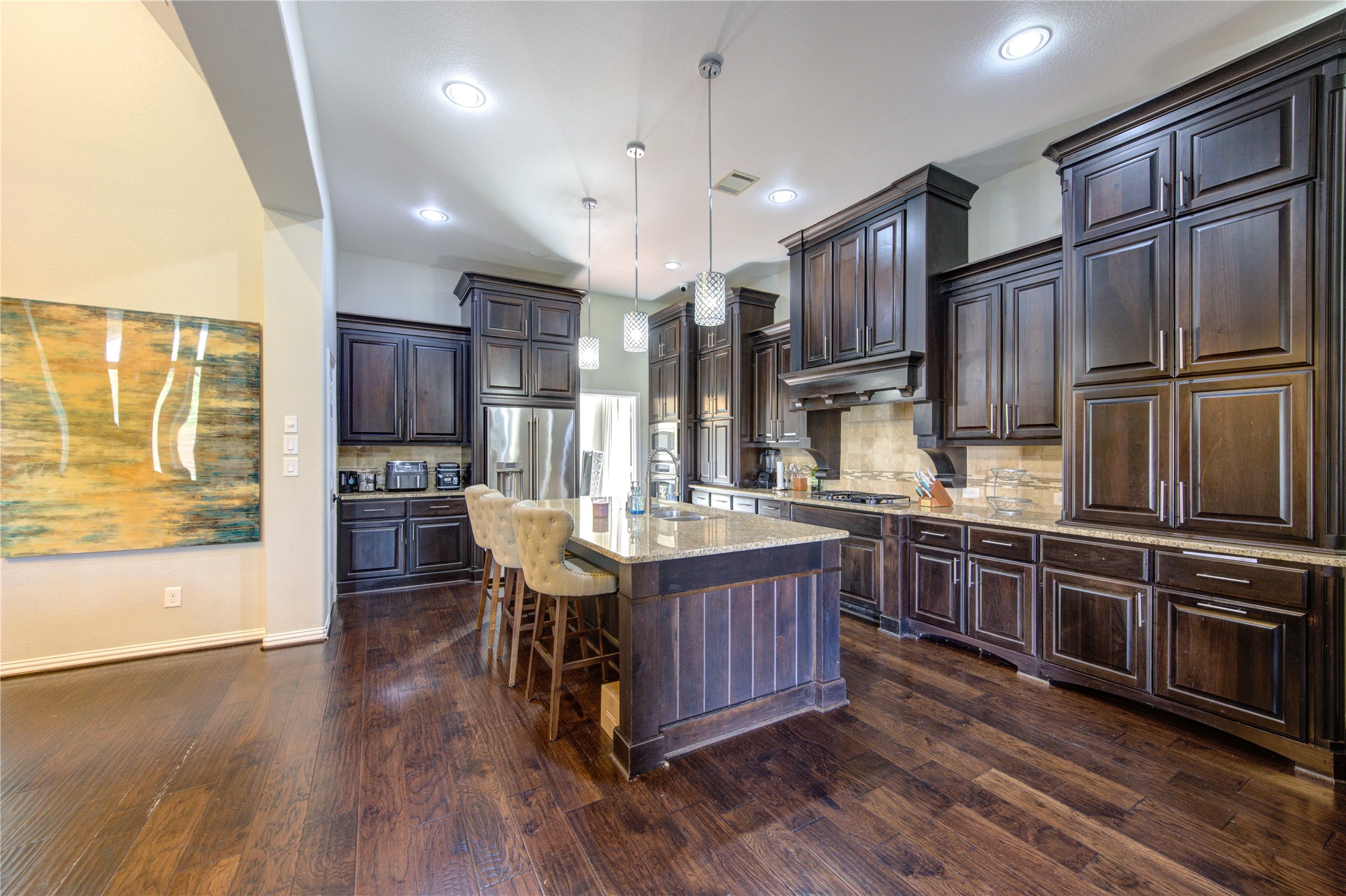 17539 Hankar Way Richmond, TX 77407 - Photo 5 of 34 a kitchen with stainless steel appliances granite countertop a sink stove and refrigerator