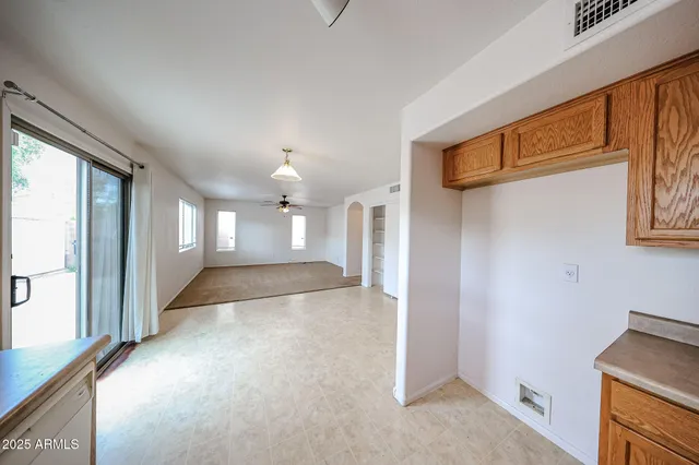 a view of a hallway with a kitchen