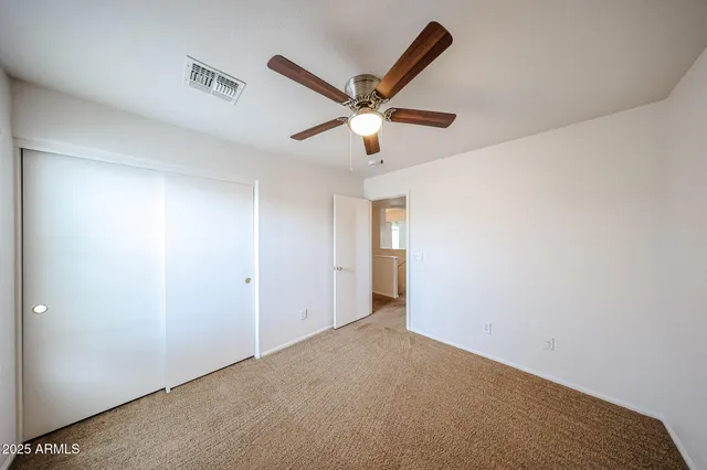 a view of a ceiling fan in a room