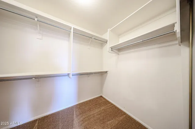 a view of an empty walk in closet