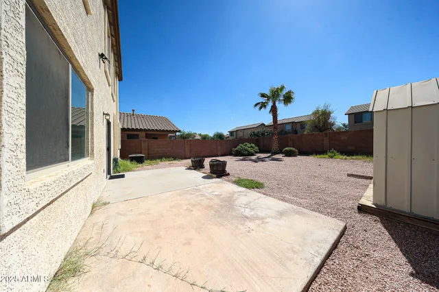 a view of a backyard of a house