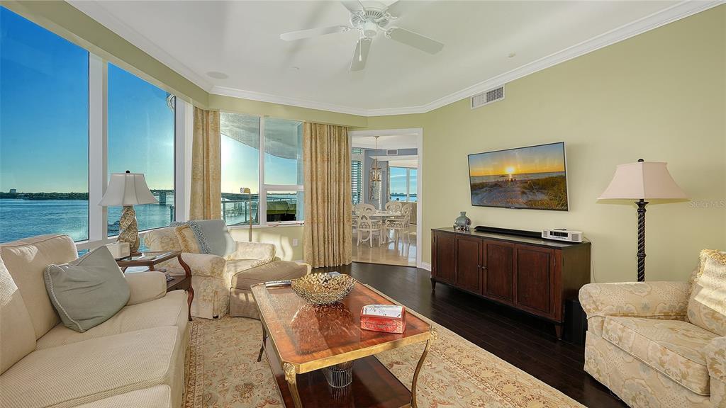136 Golden Gate Point, Unit 502 Sarasota, FL 34236 - Photo 17 of 38 a living room with furniture and a flat screen tv