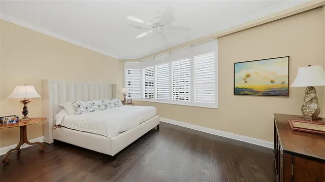 a bedroom with a bed and a night stand