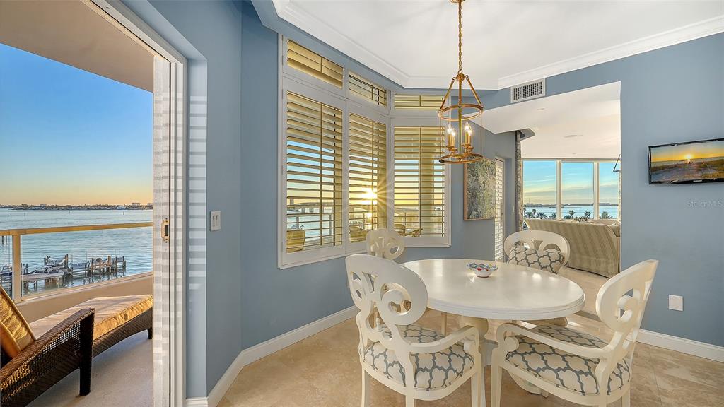 136 Golden Gate Point, Unit 502 Sarasota, FL 34236 - Photo 10 of 38 a view of a dining room with furniture window and outside view