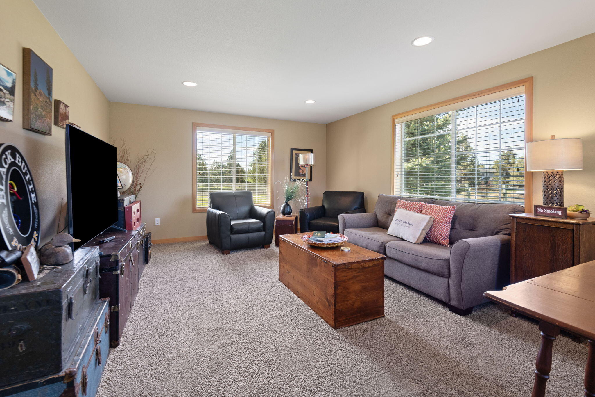 22539 Martee Lane Bend, OR 97701 - Photo 21 of 54 a living room with furniture a flat screen tv and a window