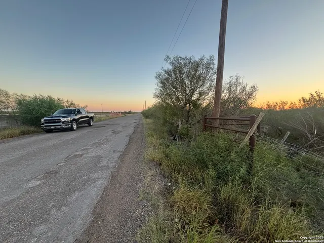 a view of street with parked cars