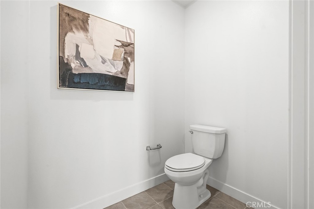 3604 Rivington Irvine, CA 92612 - Photo 31 of 54 a white toilet sitting next to a white wall