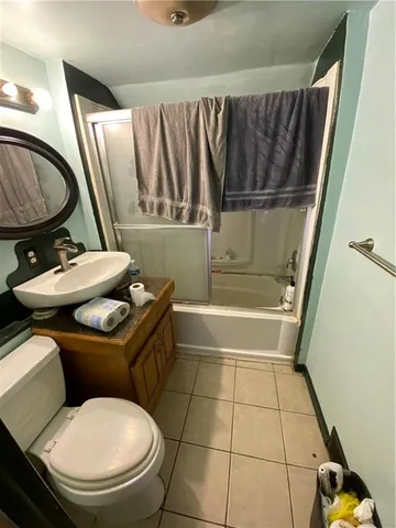 a bathroom with a toilet a sink and a bathtub