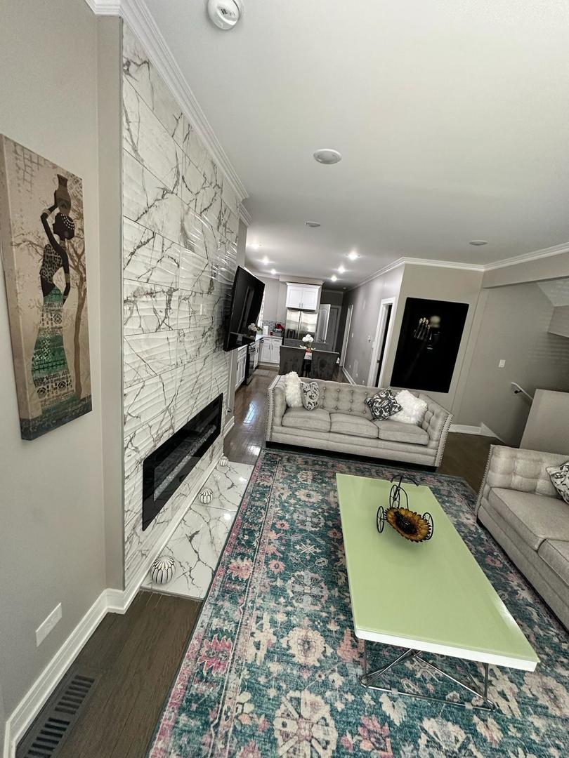 a living room with furniture and rug