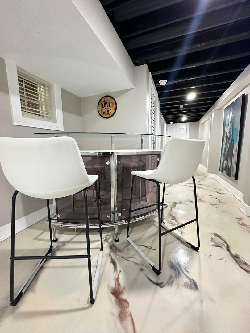 6807 South Calumet Avenue, Unit 1 Chicago, IL 60637 - Photo 13 of 17 a view of a chairs and table in the room