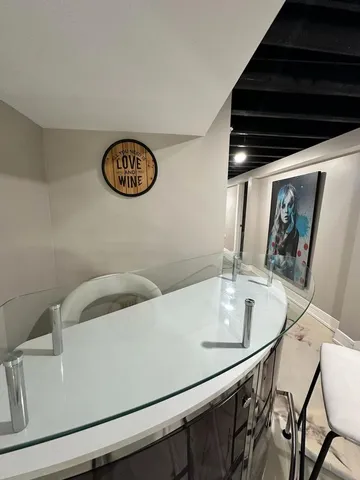 a kitchen with a table and chairs