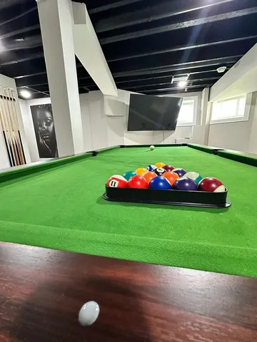 a green field with white walls